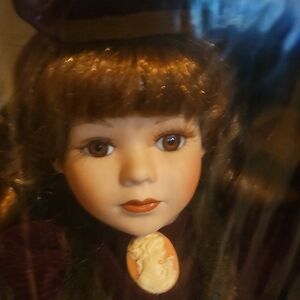 Charming Porcelain Doll with Purple Dress